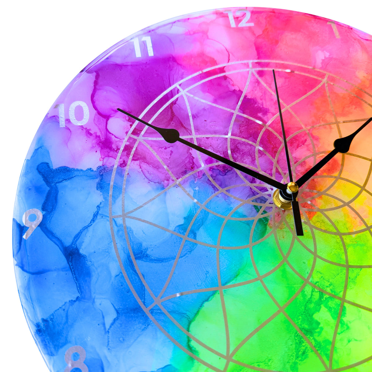 A neon coloured clock with silver detail and black hands