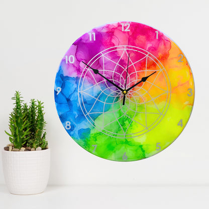 A neon coloured clock with silver detail and black hands