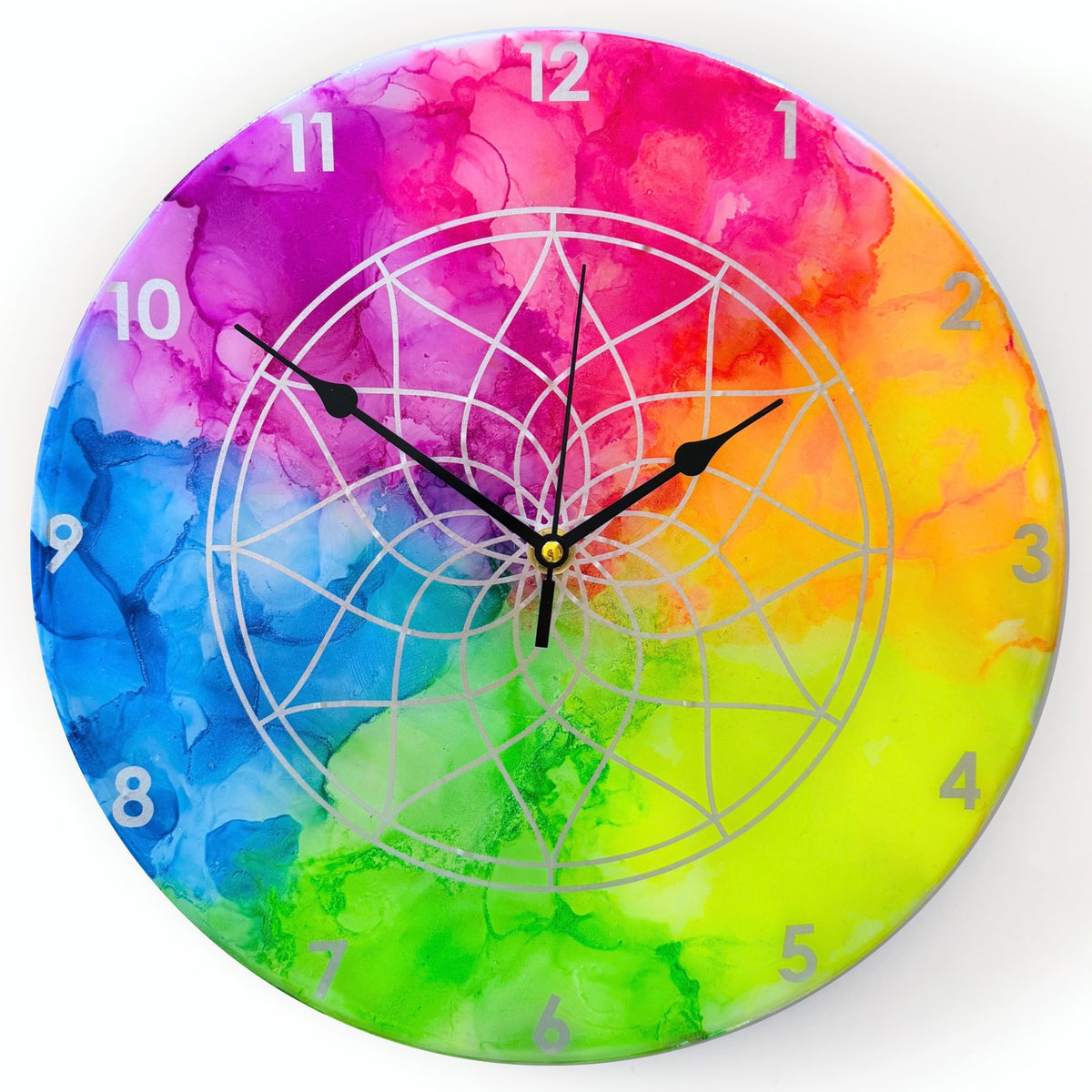 A neon coloured clock with silver detail and black hands