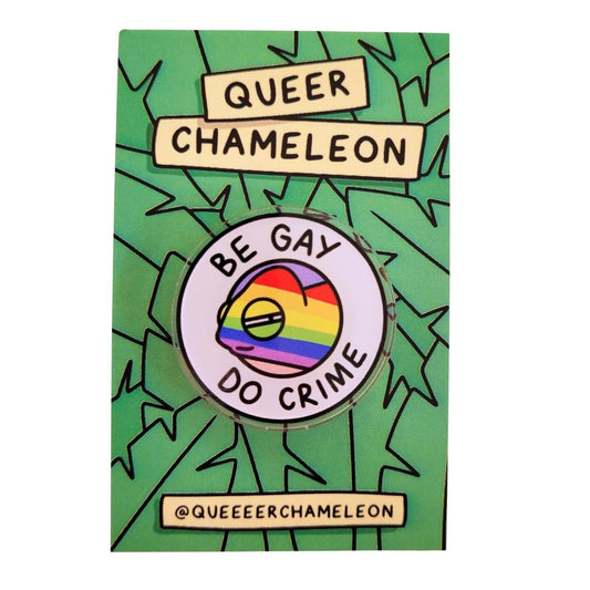 Pin with rainbow design and text on a green background