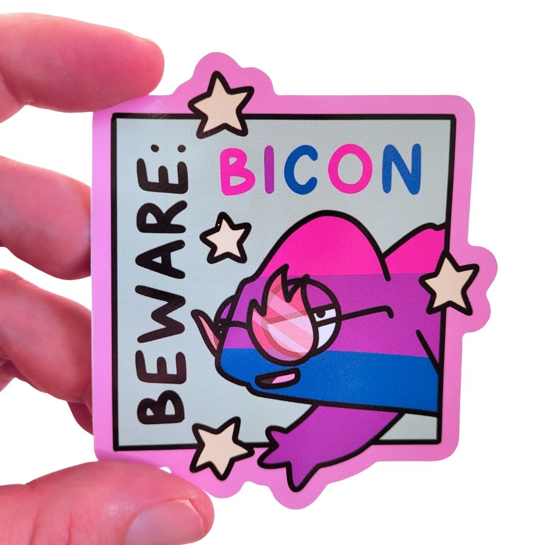 Sticker with a cartoon chameleon and 'Beware: Bicon' text held by a hand.