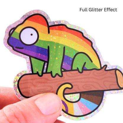 Colorful chameleon sticker with a full glitter effect held by a hand on a white background.