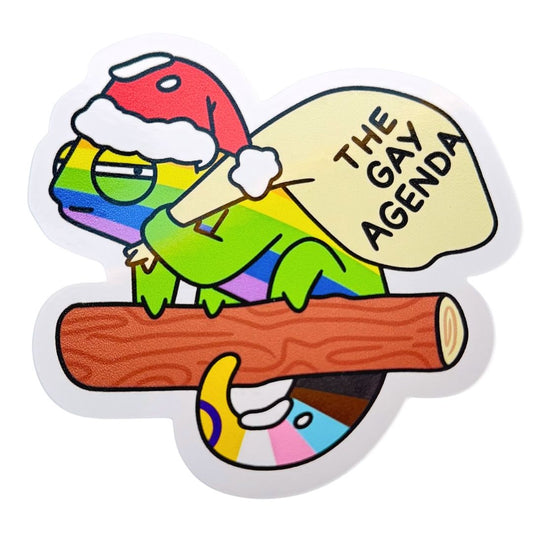 Colorful sticker of a character holding a log with 'The Gay Agenda' text on a white background