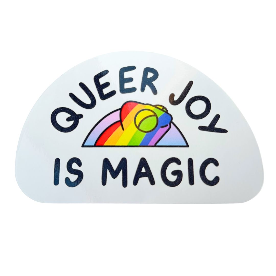 Sticker with 'Queer Joy is Magic' text and rainbow design on a white background