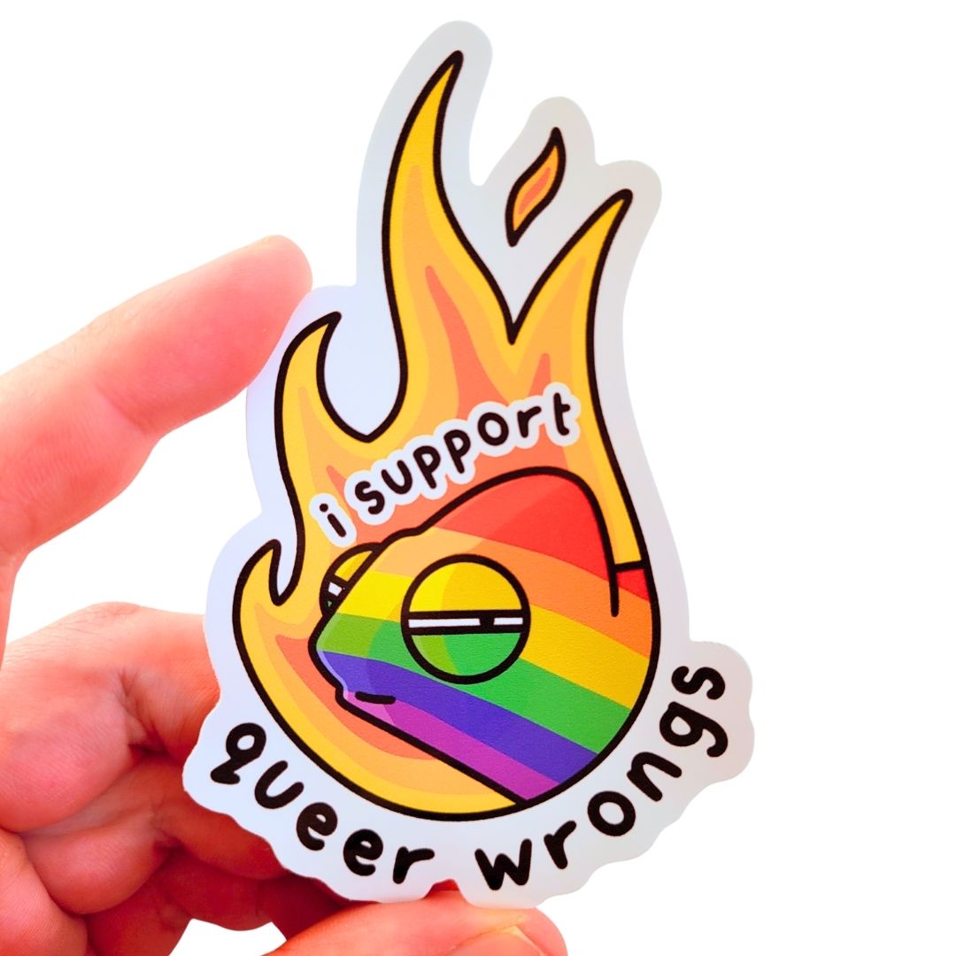 Sticker with rainbow design and text held by a hand on a white background