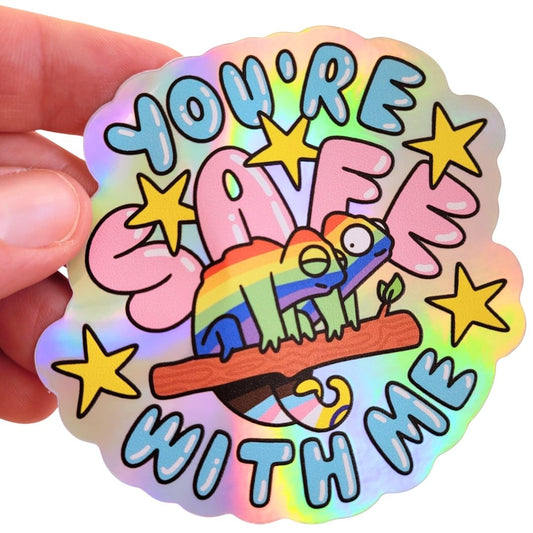 Holographic sticker with two rainbow chameleons and "you're safe with me" text held by a hand